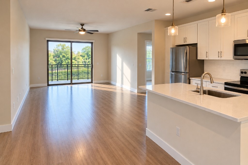 Pristine open-plan apartment kitchen and living area after a Leina Cleaning move-out clean